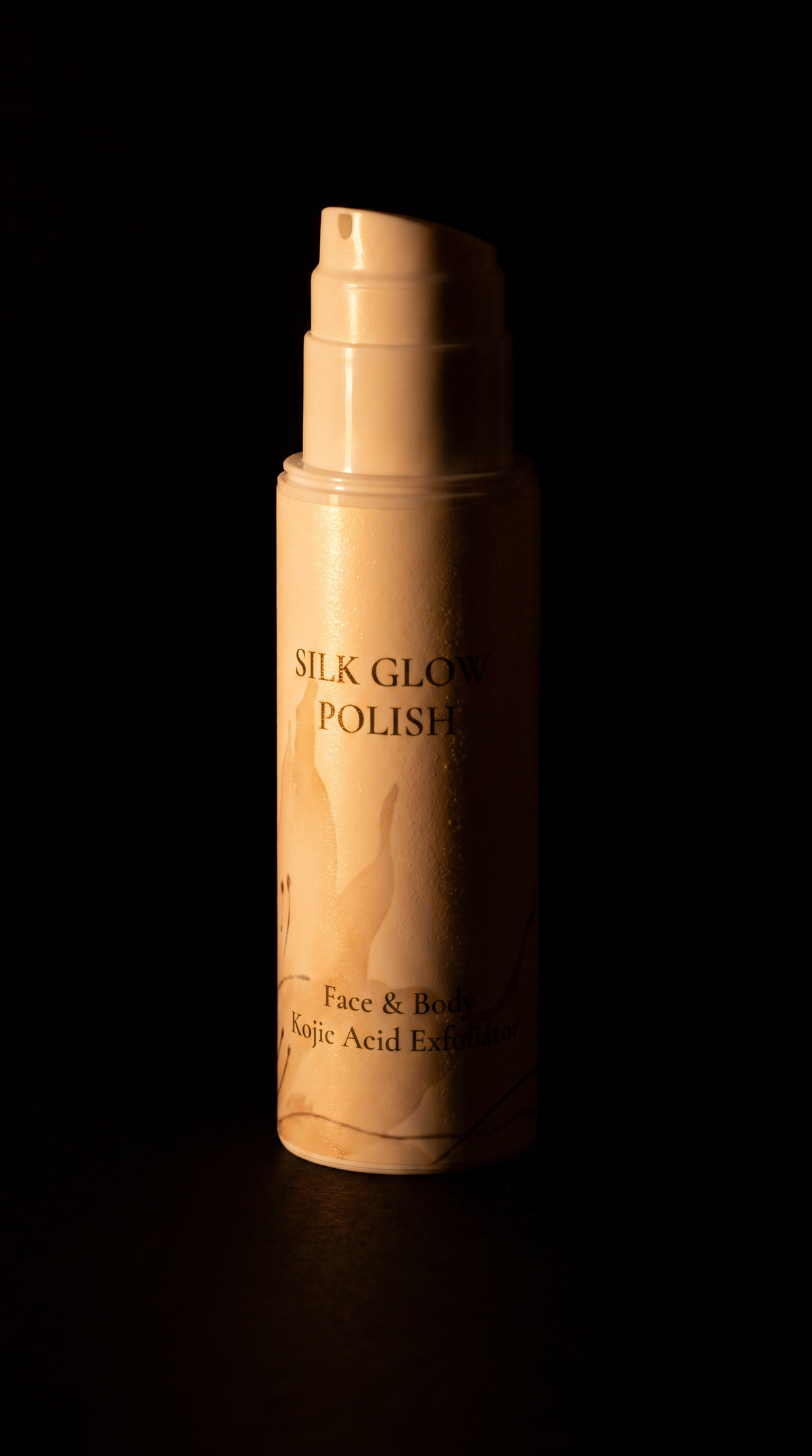 A bottle of Silk Glow Polish Face & Body Kojic Acid Exfoliator, shown in a warm beige color with gold lettering, set against a solid black background.