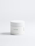 A white cosmetic jar labeled 'CLAY MASK' with a matching lid, photographed on a clean white background with a soft shadow.