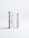 A non-tinted sunscreen stick with SPF 50 shown next to its white packaging box on a clean, light gray background.