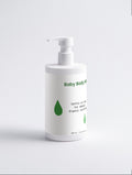 Baby body wash bottle with pump on a light gray background