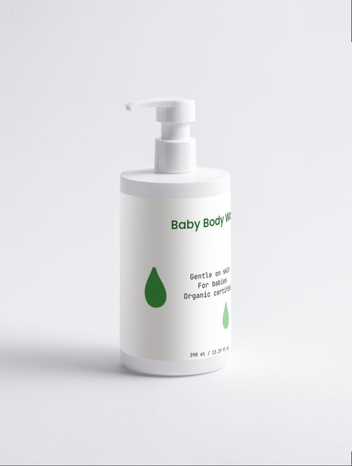 Baby body wash bottle with pump on a light gray background