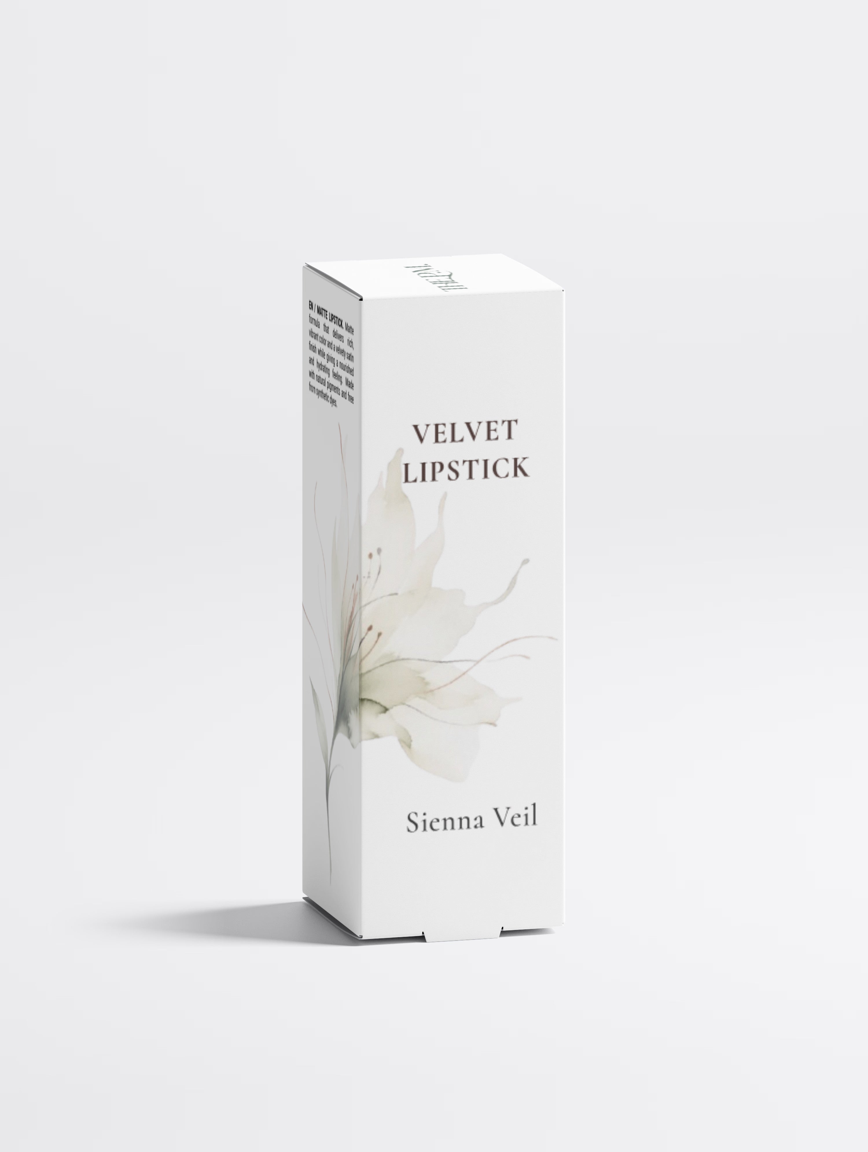 A tall white rectangular box for Velvet Lipstick in the shade Sienna Veil, featuring a delicate watercolor lily design in soft beige and gray tones on the front, set against a clean light gray background.