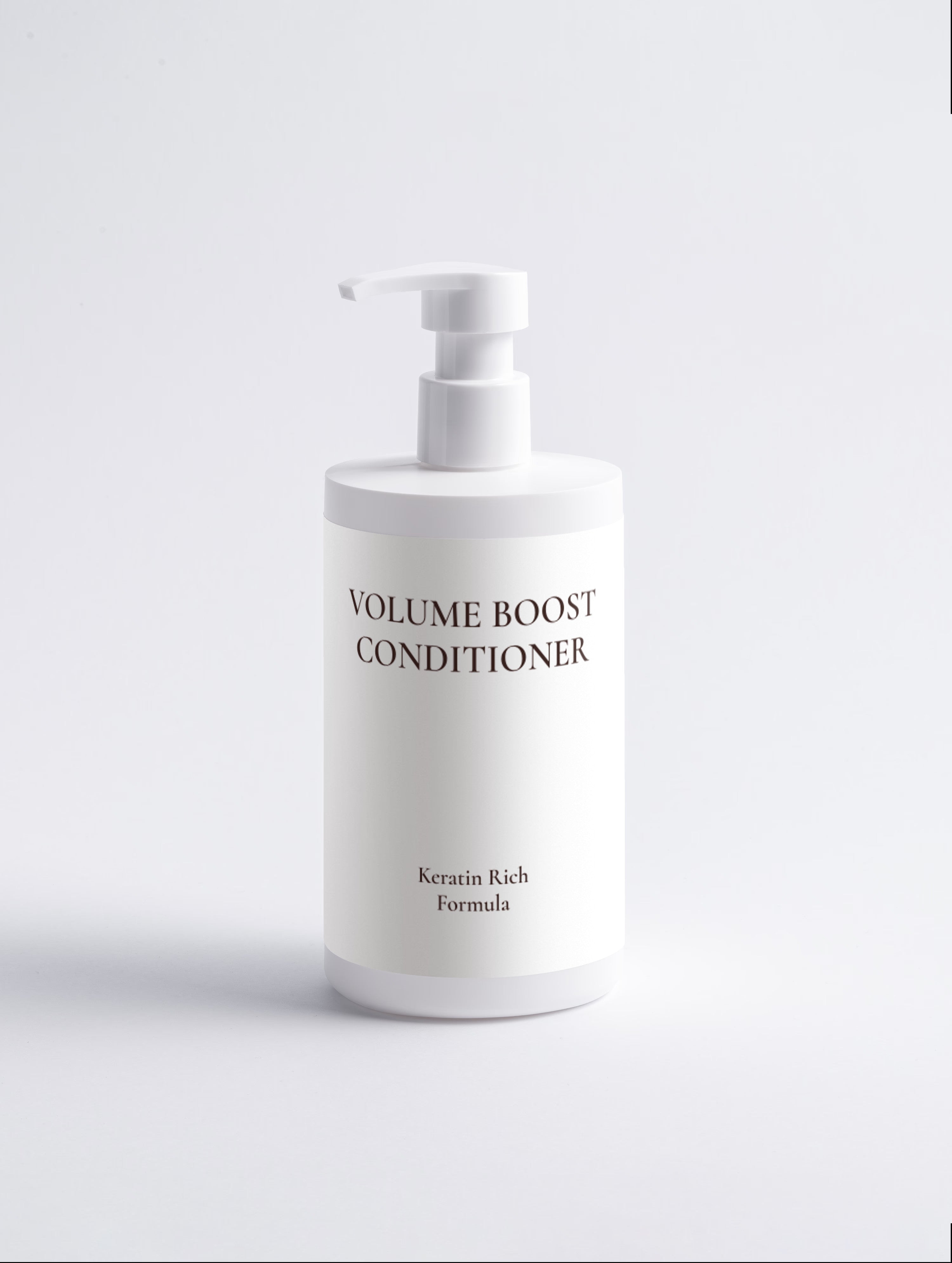 A white pump bottle of Volume Boost Conditioner with black text, set against a clean white background.