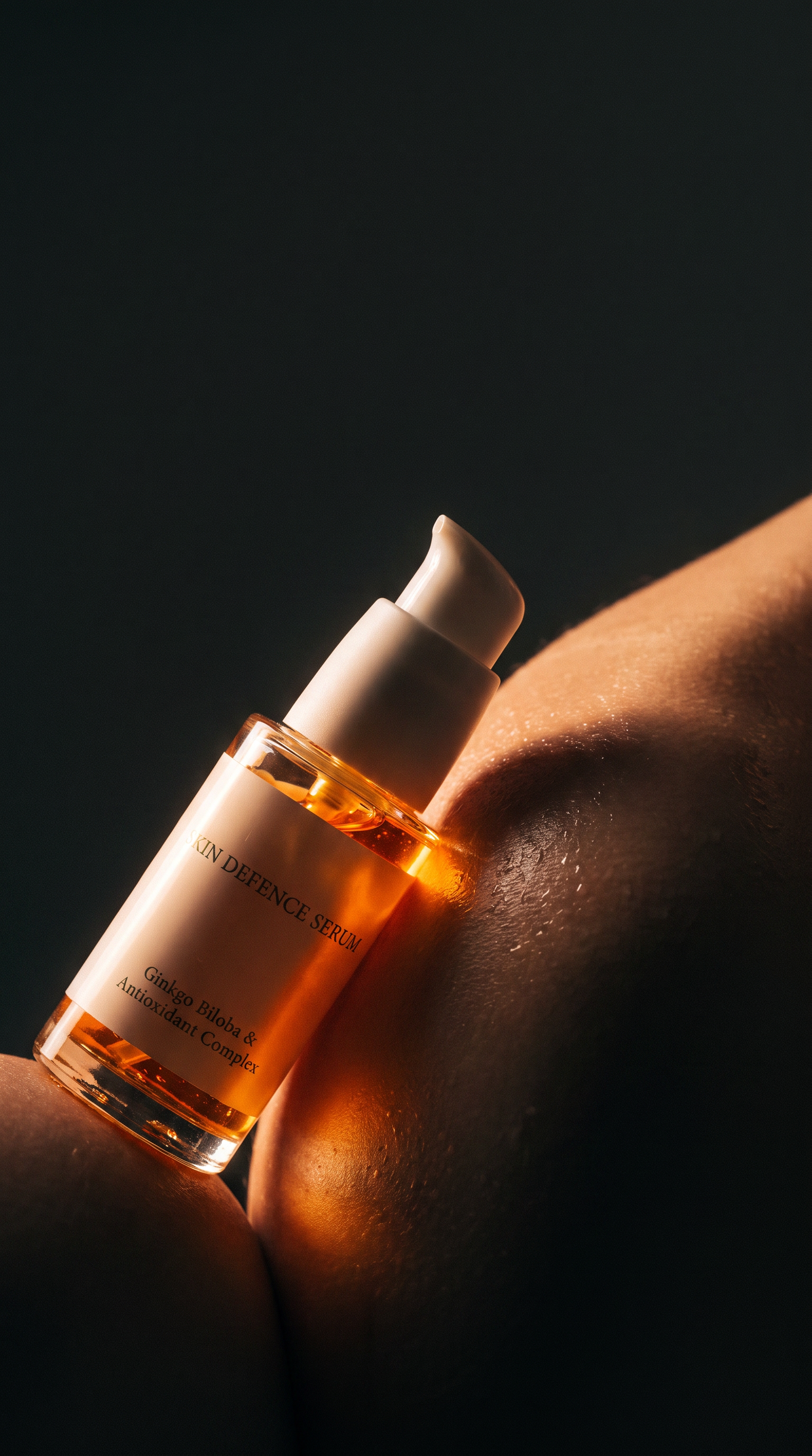 A close-up of a skincare serum bottle resting against a person's shoulder, with warm golden light highlighting the amber liquid and white pump dispenser against a dark background.